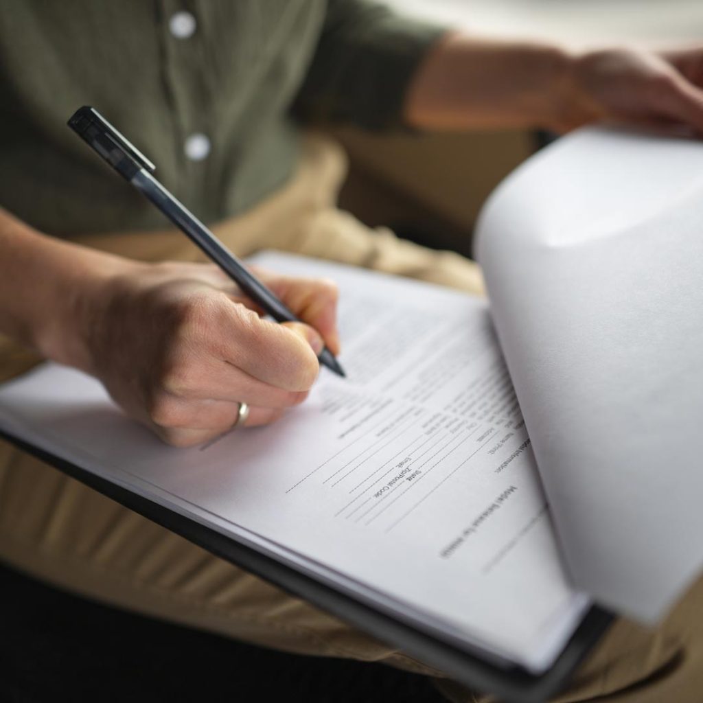 high angle professional filling out forms